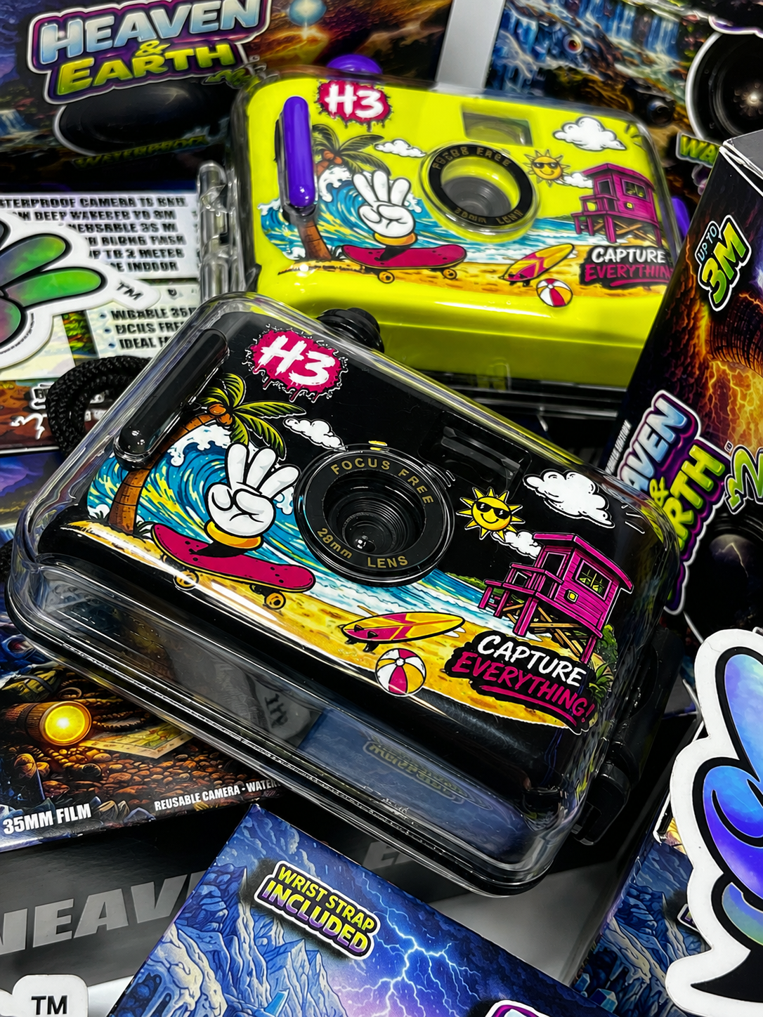 Colorful H3 camera with 'Heaven & Earth' branding on a stack of similar cameras.